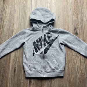Nike Boys Zip Full Zip Hoodie ( Big Nike Swoosh ). 
Size: 6
Color: Grey